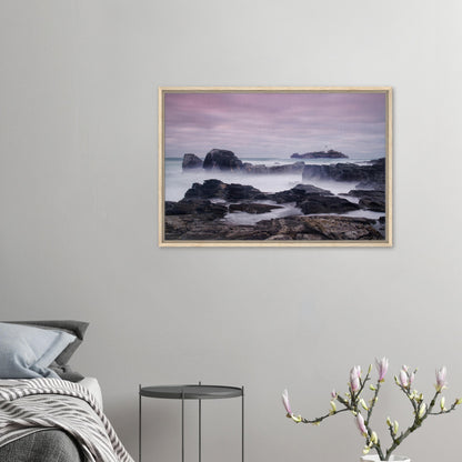 Framed artwork of Godrevy Lighthouse under lavender and peach sky