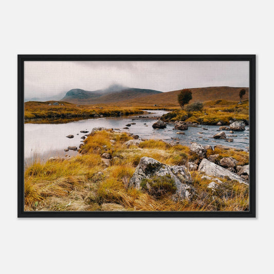 Scottish Highlands loch with misty backdrop