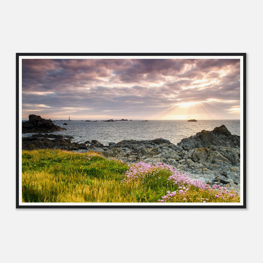 Les Hanois Lighthouse on the horizon at Pleinmont Point framed print