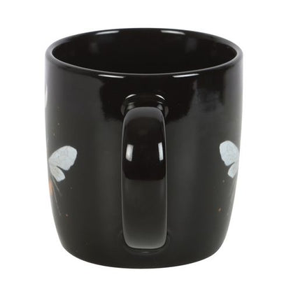 Black ceramic mug with dark forest bee design, crescent moon, and stars. 340ml capacity.