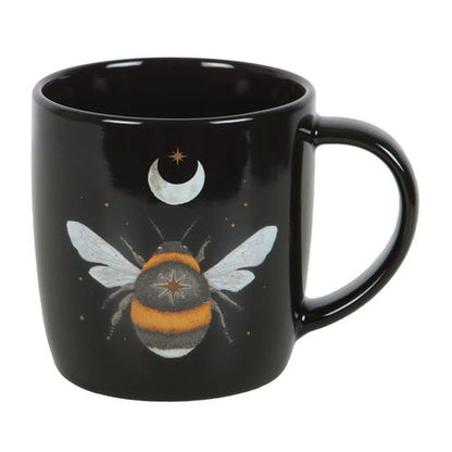 Black ceramic mug with dark forest bee design, crescent moon, and stars. 340ml capacity.