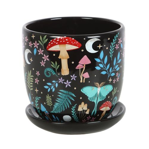 Dark forest print plant pot with colourful flora, fauna, and moon and star design, complete with matching saucer.