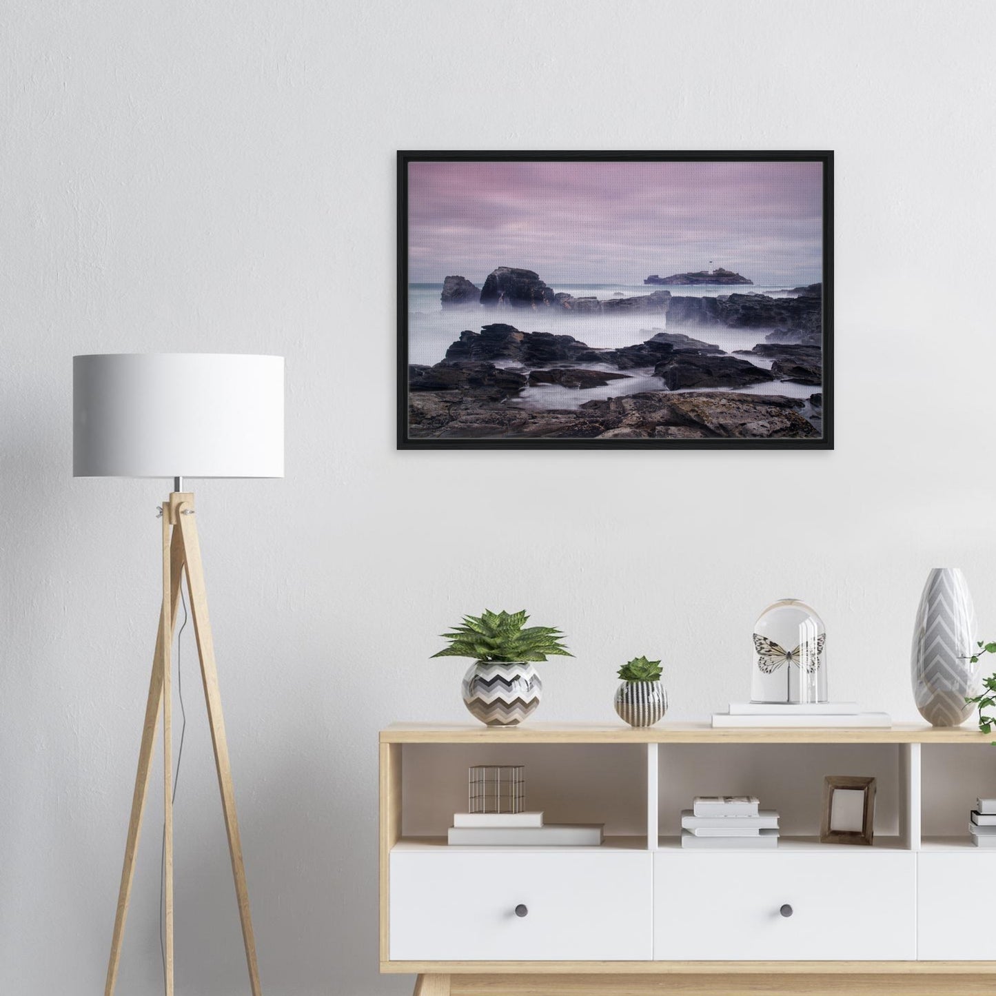 Dreamy coastal view of Godrevy Lighthouse and rocky shoreline