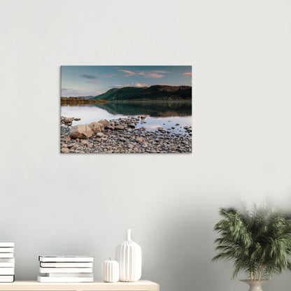 Peaceful lakeside moment in Cumbria with pastel colours and mirrored sky