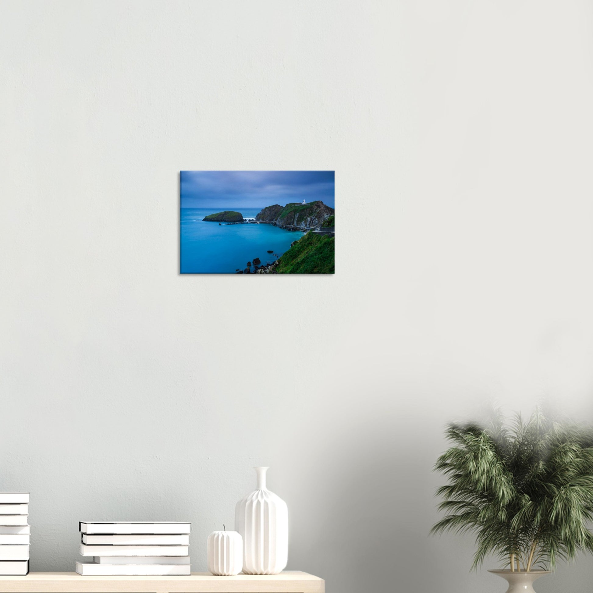 Peaceful coastal canvas from Lundy Island featuring the lighthouse on rugged cliffs as twilight envelops the bay and pier.