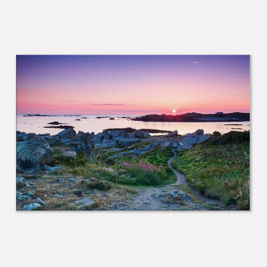 Guernsey sunset canvas featuring Lihou Island’s rocky shoreline, winding trail, and vivid floral detail at dusk.