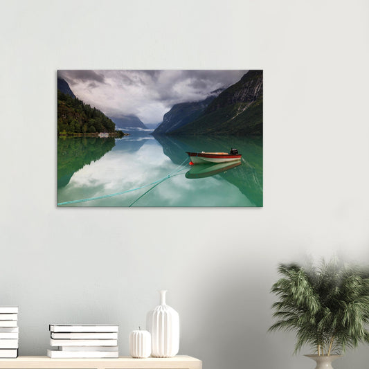 Canvas print of Lovatnet Lake in Norway with solitary boat on emerald waters.