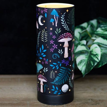 Electric aroma lamp with mystical forest design, stars that light up, and fragrance oil or wax melt compatibility.