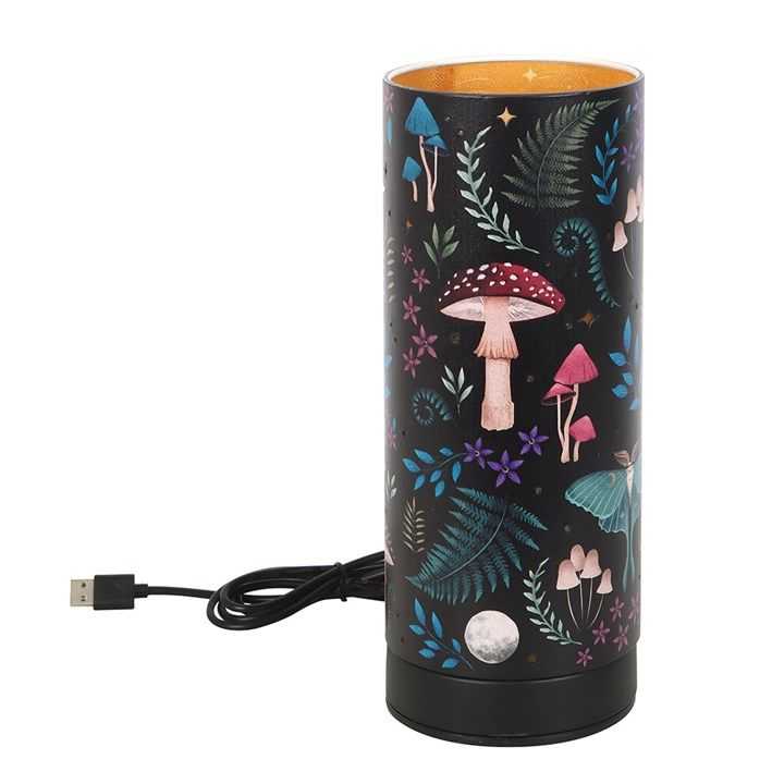 Electric aroma lamp with mystical forest design, stars that light up, and fragrance oil or wax melt compatibility.