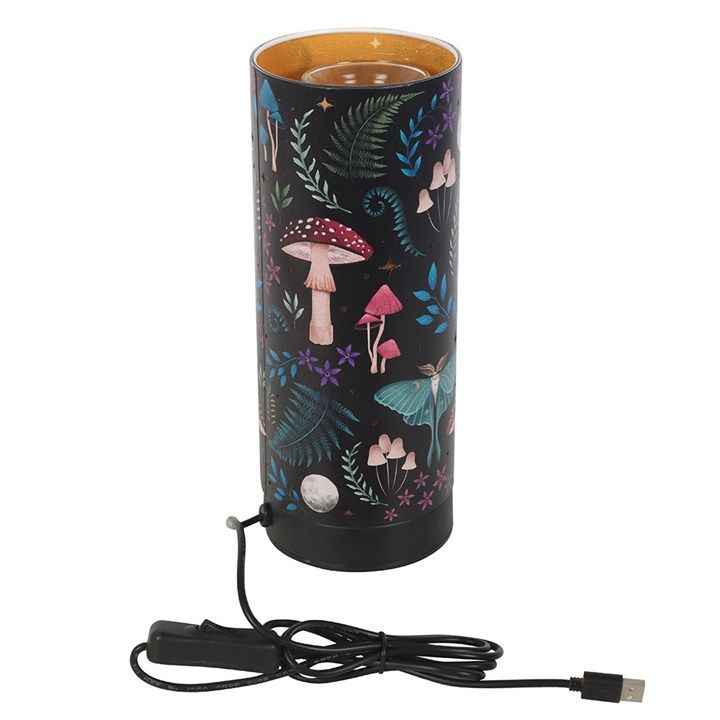 Electric aroma lamp with mystical forest design, stars that light up, and fragrance oil or wax melt compatibility.