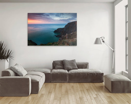 Printable wall art of Devon coastline with calm sea and cliffs