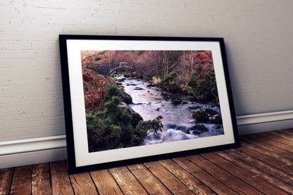 Flowing river with mossy rocks West Okement Dartmoor