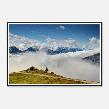 Solitary hut on verdant hilltop surrounded by clouds in Austria