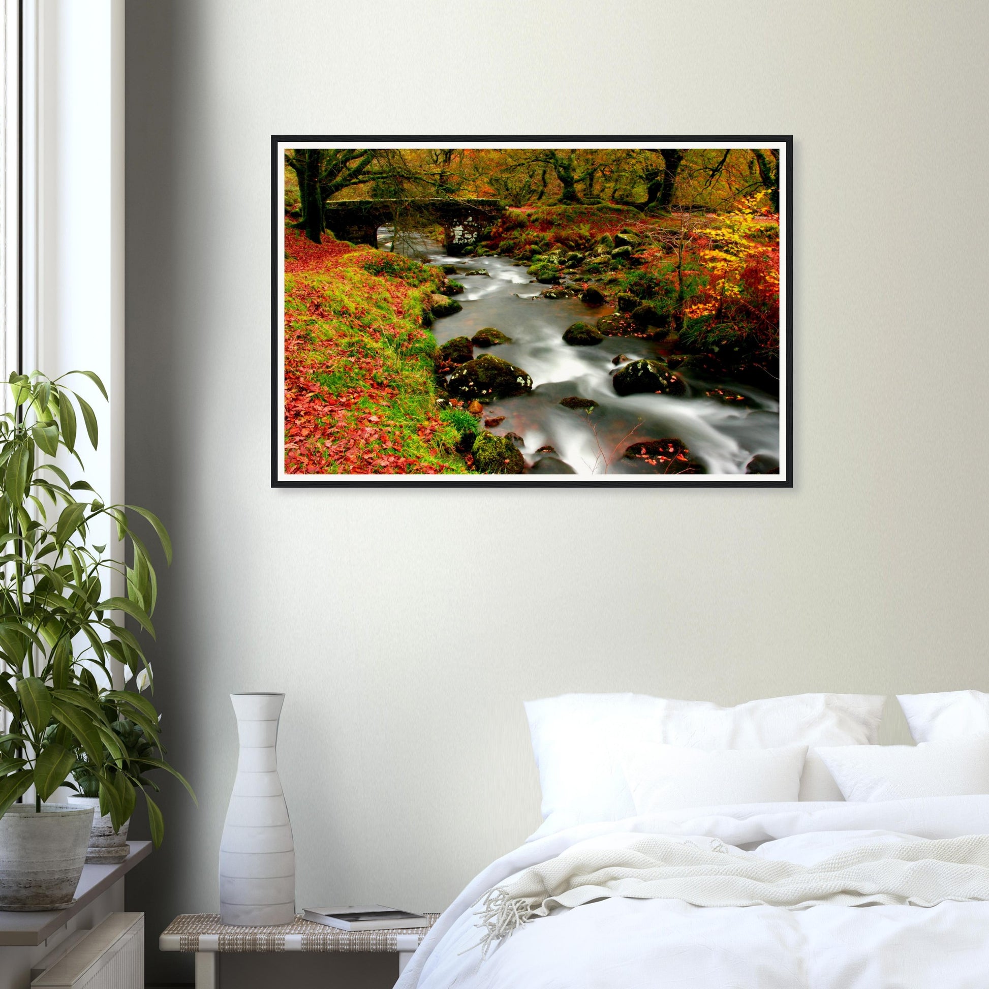 Autumn forest stream with mossy rocks at Burrator Reservoir
