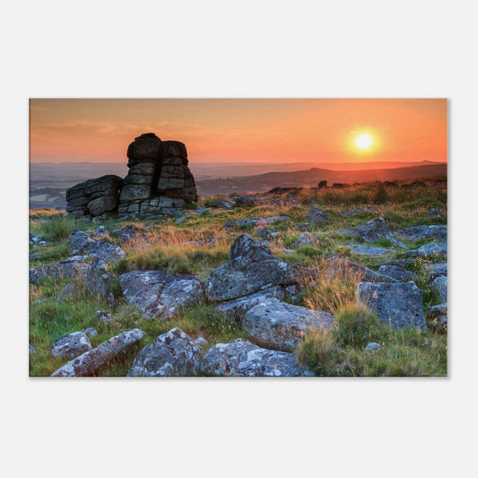 Stunning Dartmoor landscape featuring rugged granite rocks and sun-kissed grasses at dusk
