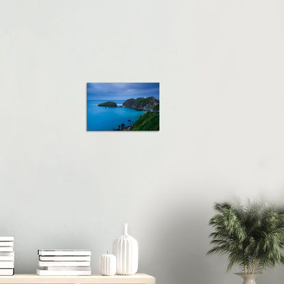 Tranquil twilight canvas print of Landing Bay on Lundy Island, where the lighthouse overlooks calm waters and a distant pier.