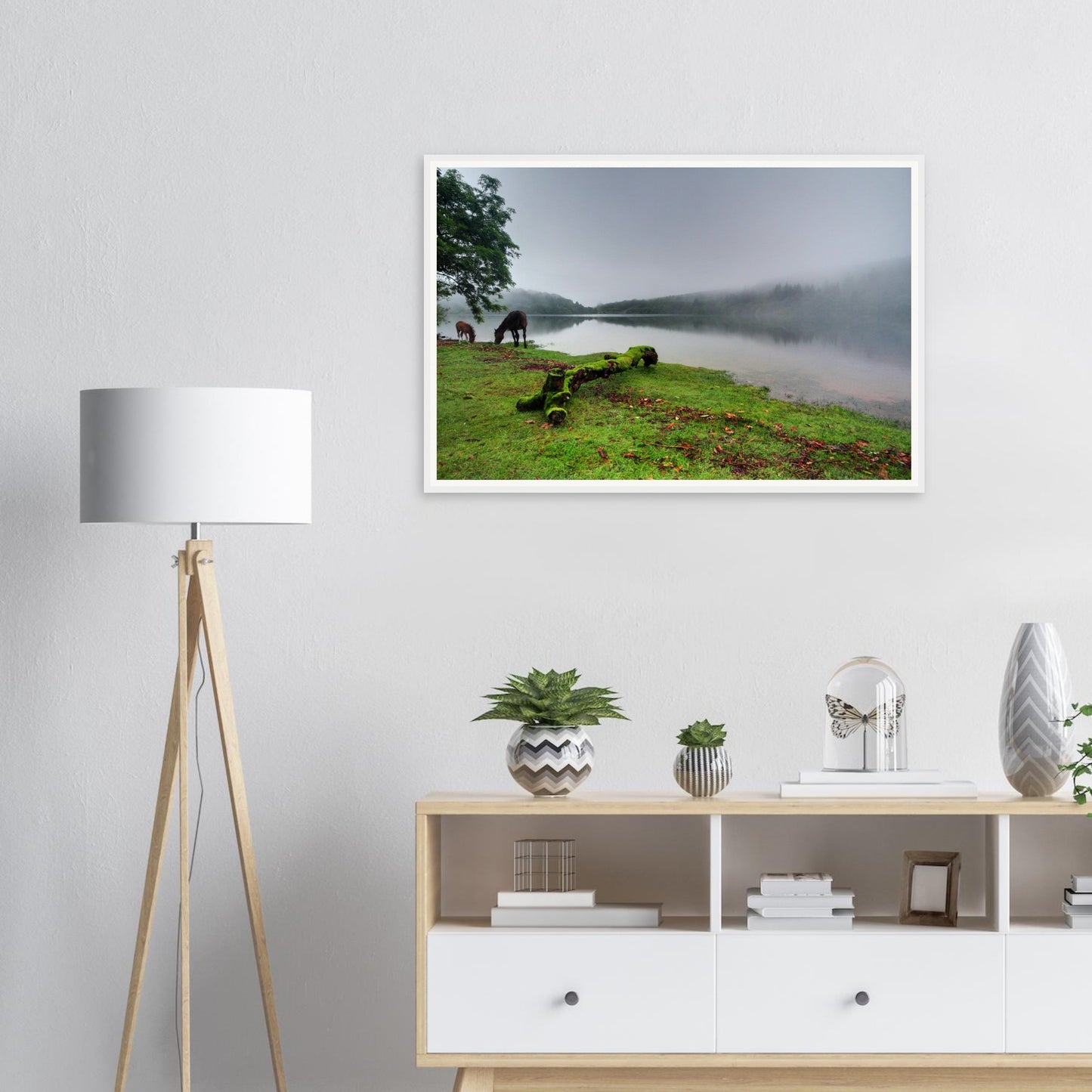 Peaceful grazing horses at Burrator Reservoir in morning fog