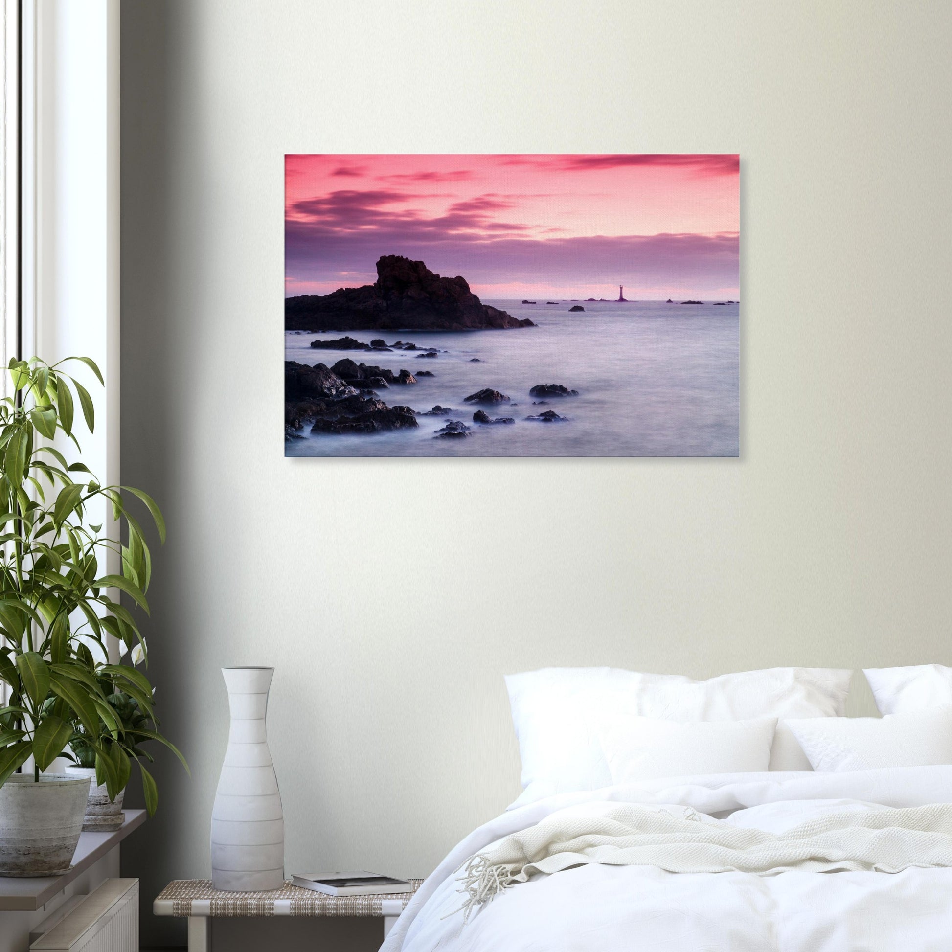Tranquil sunset canvas from Guernsey, featuring Les Hanois Lighthouse and a peaceful shoreline beneath a glowing sky.