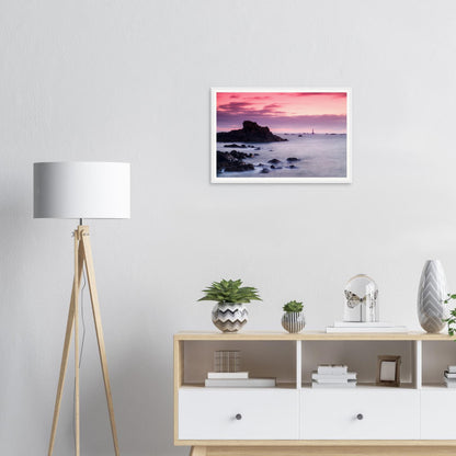 Tranquil sea at dusk with Les Hanois Lighthouse framed print
