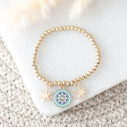 Gold tone beaded bracelet with all seeing eye and star charms