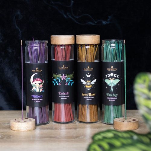 Display set of 20 incense tubes featuring dark forest designs, with Wildberry, White Sage, Sweet Honey, and Patchouli fragrances.