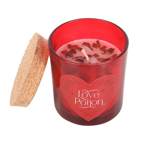 Love Potion candle with red jasper crystal chips and raspberry fragrance, designed to enhance courage and passion.