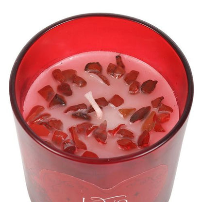 Love Potion candle with red jasper crystal chips and raspberry fragrance, designed to enhance courage and passion.