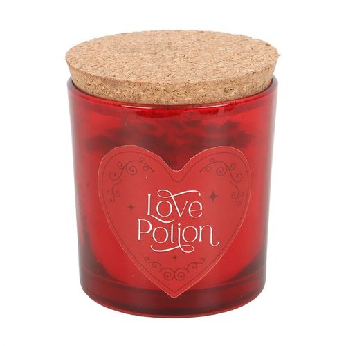 Love Potion candle with red jasper crystal chips and raspberry fragrance, designed to enhance courage and passion.