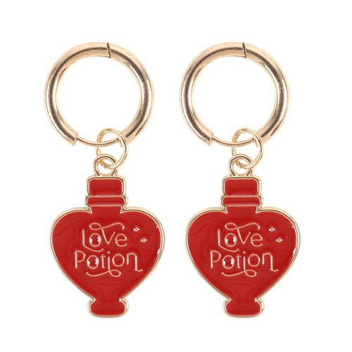 Gold-tone earrings with enamel love potion charms, a playful and romantic accessory.