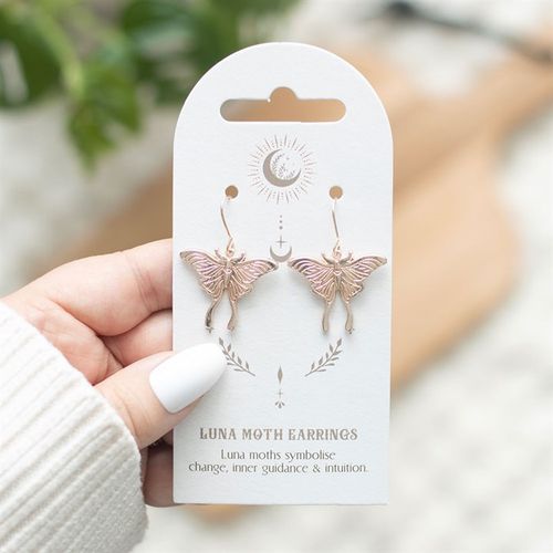 Dangling stainless steel Luna Moth earrings on decorative backing card