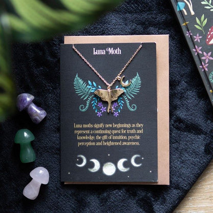 Gold-tone Luna Moth necklace with crescent moon charm on matching greeting card