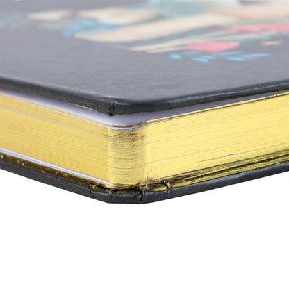 A5 notebook with mystical mushroom design, gold foil page edges, and ribbon marker.