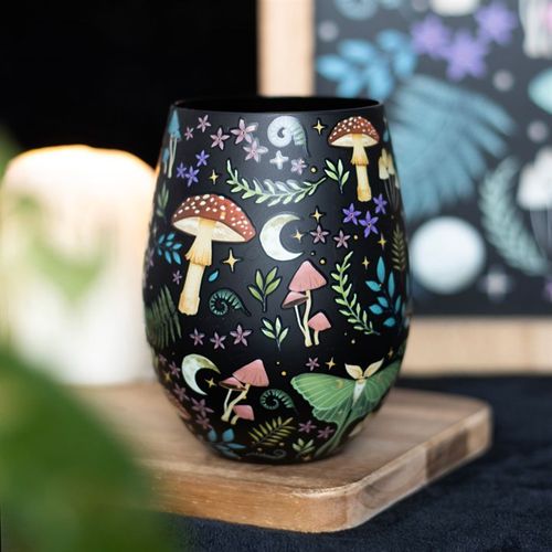 Stemless glass featuring night forest design with florals, toadstools, luna moths, and celestial moon and star details.