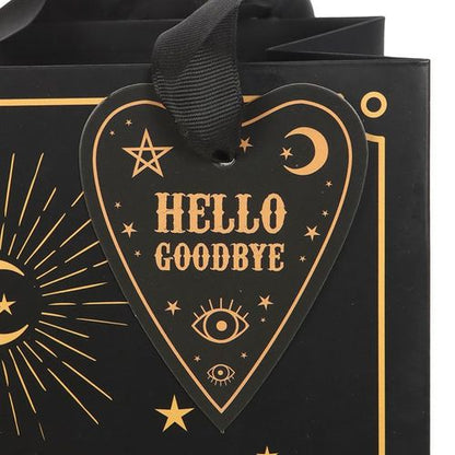 Printed gift bag with black and gold talking board design, perfect for adding mystery to presents.