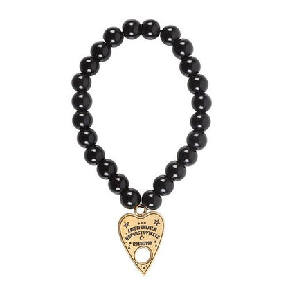 Nickel-free stainless steel talking board planchette bracelet with black beads and gold-tone charm.