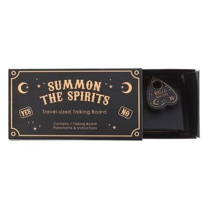 Travel-sized black and gold talking board with mini spirit board and planchette, designed for light-hearted entertainment.