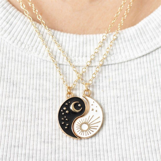 Yin and Yang necklace set with sun and moon charms symbolising balance.