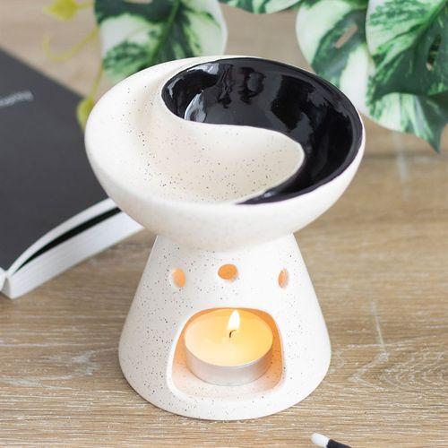 Yin and Yang oil burner and wax warmer with split dish for mixing scents.