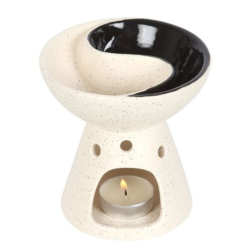 Yin and Yang oil burner and wax warmer with split dish for mixing scents.